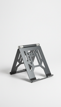 Architectural foldable laptop stand, Hero product shots at a precise 3/4 angle to showcase both face and edge...